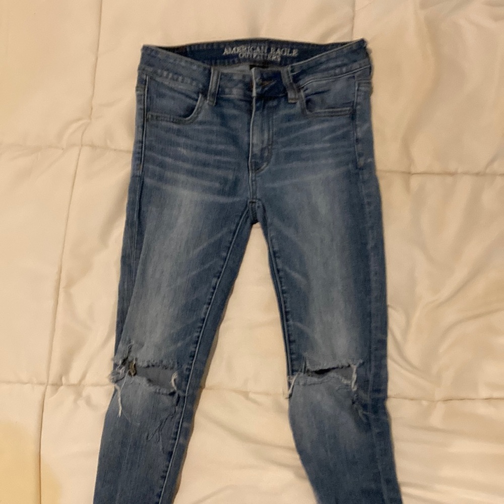 Blue ripped American eagle skinny jeans